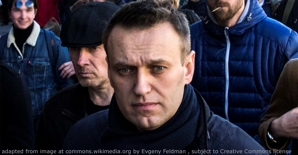 File Photo of Alexei Navalny Marching on Street with Others in Background; adapted from image at commons.wikimedia.orgadapted from image at commons.wikimedia.org with credit to Evgeny Feldman, subject to Creative Commons license; original image at commons.wikimedia.org/wiki/File:FEV_1795_(cropped1).jpg, with license information at creativecommons.org/licenses/by-sa/4.0/deed.en and creativecommons.org/licenses/by-sa/4.0/legalcode