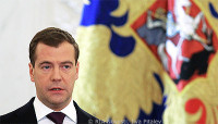 File Photo of Dmitry Medvedev Before Gold Flag with Elaborate Design