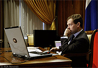 File Photo Dmitry Medvedev at Desk with Laptop Computer