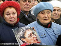 File Photo of Mourners with Photo of Anna Politkovskaya