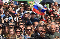 File Photo of Crowd of Russians with One Waving Russian Flag