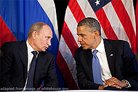 File Photo of Vladimir Putin Leaning Towards Barack Hussein Obama With Flags Behind Them