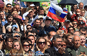 File Photo of Russian Crowd, with Russian Flag Being Waved