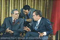 Leonid Brezhnev and Richard Nixon Sitting and Talking, as Nixon Gestures, with Third Man Standing and Leaning Closely Between Them