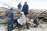 File Photo of Hurricane Sandy Victims and Relief Personnel Near Rubble of Home Destroyed
