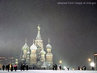 File Photo of Moscow In Snowy Winter Showing St. Basil's At Night in Snowfall, with People on the Ground in the Distance