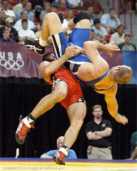 File Photo of Olympic Wrestling Match, adapted from defense.gov image