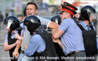 File Photo of Alexei Navalny Being Grabbed by Police at Protest