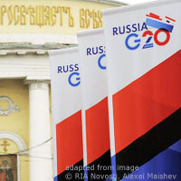 File Photo of Russia-Hosted G20 Banners Outdoors Before Yellow and White Facade of Historic-Looking Building
