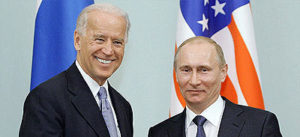 File Photo of Joe Biden and Vladimir Putin in front of U.S. Flag and Russian Flag, adapted from image from RIA Novosti