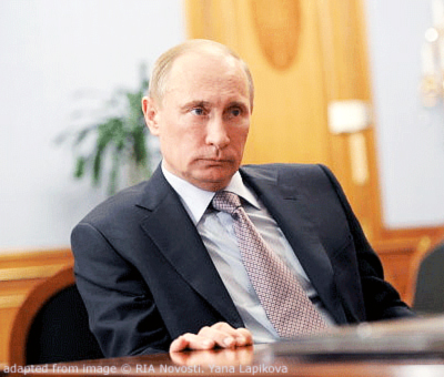 File Photo of Vladimir Putin Seated at Desk