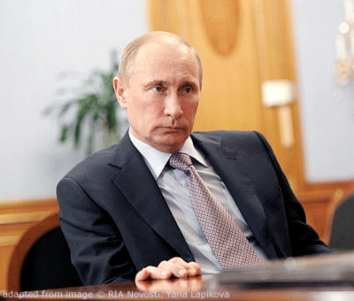 File Photo of Vladimir Putin Sitting at Desk