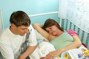 Couple in Hospital with Newborn