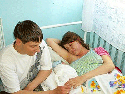 Couple in Hospital with Newborn