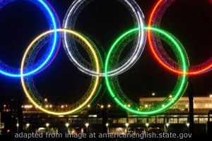 Olympic Rings Lit at Night, adapted from image at state.gov