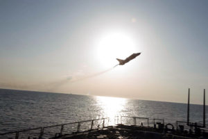 Russian Jet Buzzing U.S. Navy Destroyer, adapted from U.S. Navy photo