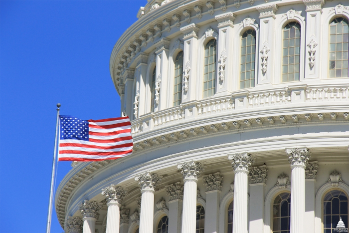 American Flag and Partial View of U.S. Capitol Dome, adapted from image at aoc.gov