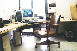 File Photo of Empty Chair and Desk with Computer, adapted from image at osha.gov