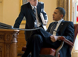 File Photo of Michael McFaul Standing and Barack Hussein Obama Sitting at Desk, adapted from image at whitehouse.gov