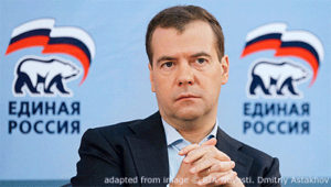 File Photo of Dmitry Medvedev with United Russia Logos Behind Him