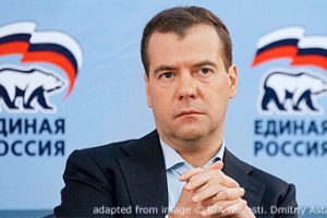 File Photo of Dmitry Medvedev with United Russia Logos Behind Him