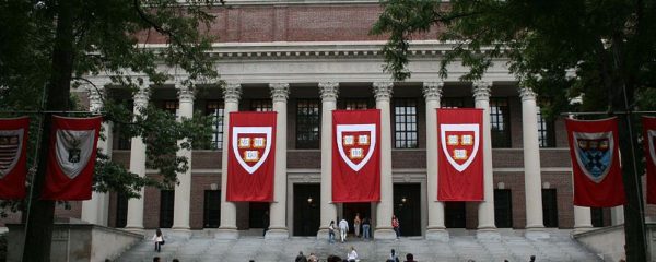File Photo of Library at Harvard University with Banners and Persons Walking on Quad, from image at state.gov