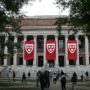 File Photo of Library at Harvard University with Banners and Persons Walking on Quad, from image at state.gov