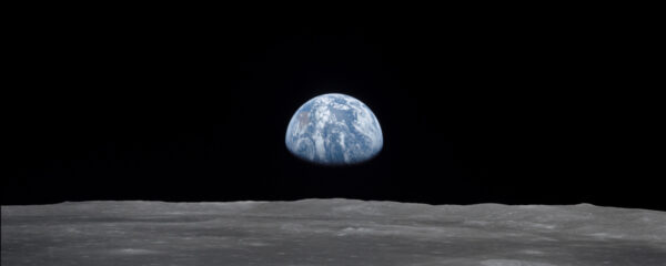File Photo of Surface of Moon with Earth in Distance, adapted from NASA image