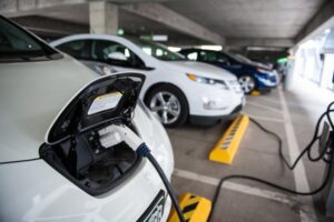 File Photo of Electric Cars being charged, adapted from image at doe.gov