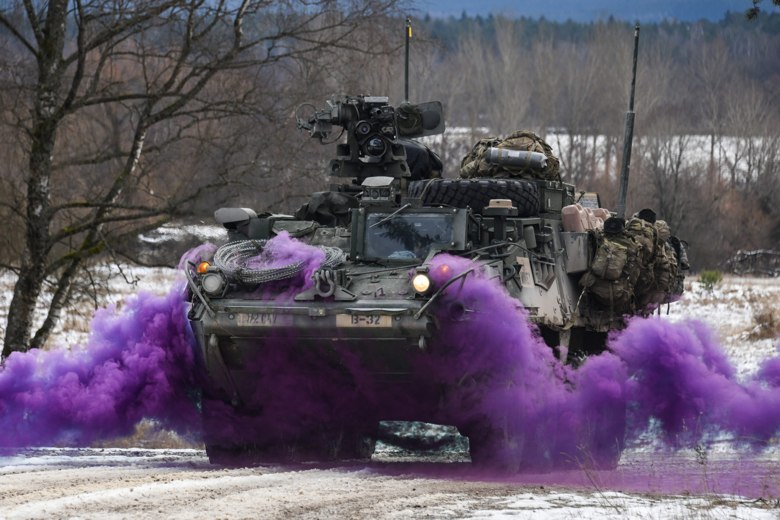File Photo of American Tank in Germany with Purple Smoke, adapted from defense.gov image with photo credit to Markus Rauchenberger, U.S. Army