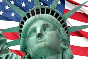 Statue of Liberty Head and U.S. Flag, adapted from image at uscis.gov