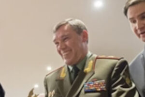 File Photo of U.S. Army Gen. Martin E. Dempsey, left, chairman of the Joint Chiefs of Staff, accepts a gift from his Russian counterpart, Gen. Valery V. Gerasimov, during a meeting in Brussels, Jan. 21, 2014. Photo adapted from image at defense.gov.