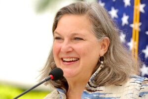 File Photo of Victoria Nuland and U.S. Flag, adapted from image featured at usembassy.gov