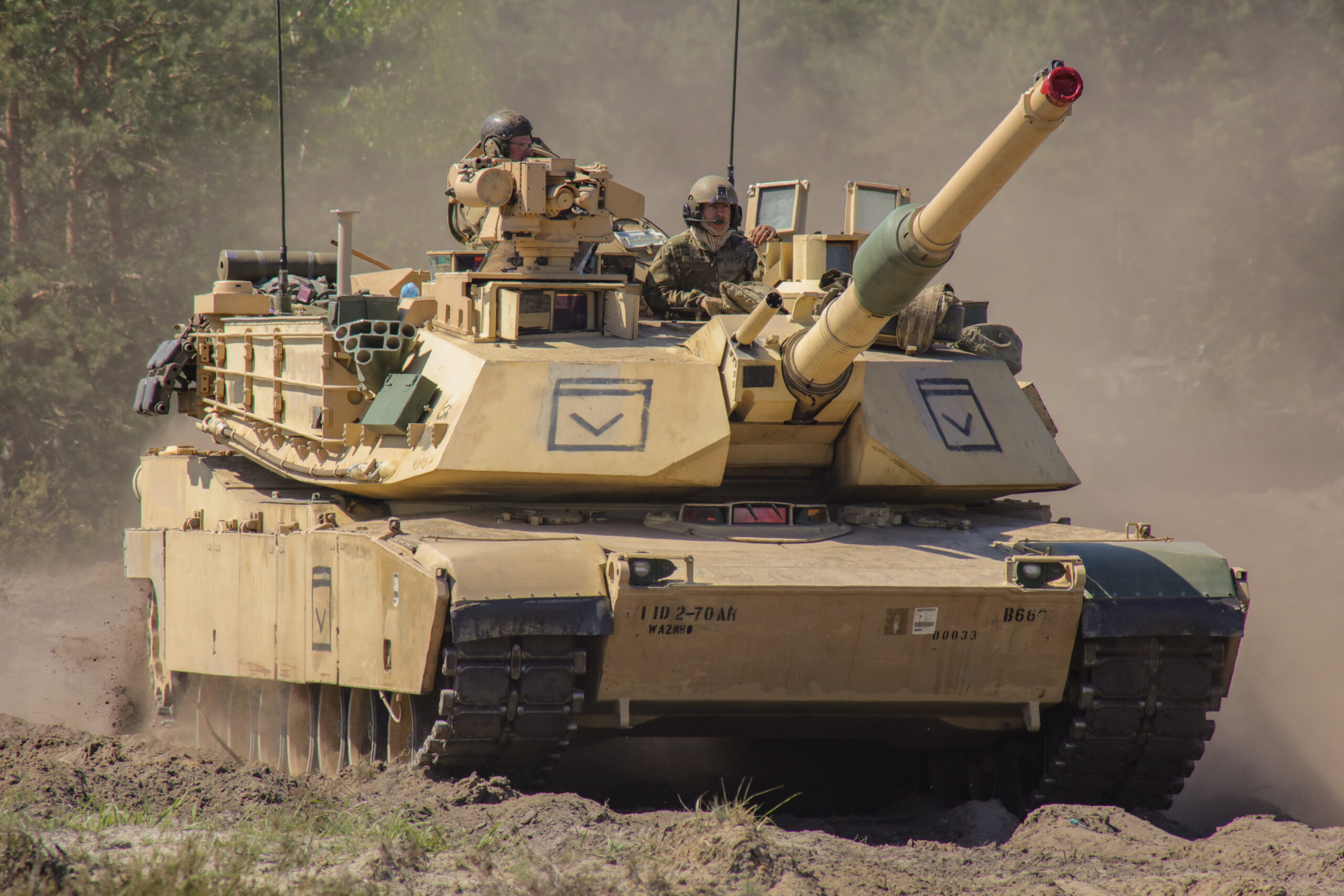M1 Abrams Tank and Some of Its Crew, adapted from defense.gov image with photo credit to Army Sgt. 1st Class Theresa Gualdarama, National Guard