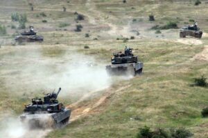 U.S. Tanks in Field Amidst Military Exercises in Europe, adapted from eucom.mil image