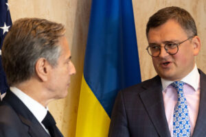 File Photo of Antony J. Blinken and Dmytro Kuleba Standing and Speaking Before U.S. and Ukrainian Flags, adapted from state.gov image