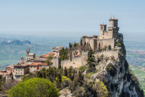 File Photo of Towers of San Marino on Mountain Top, adapted from state.gov photo
